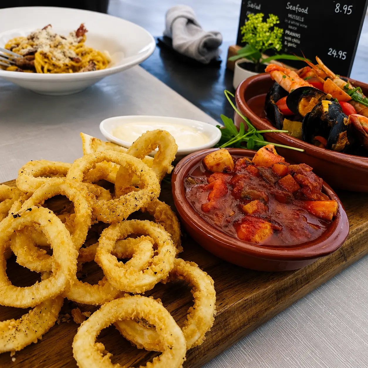 Fried calamari with a rich tomato stew