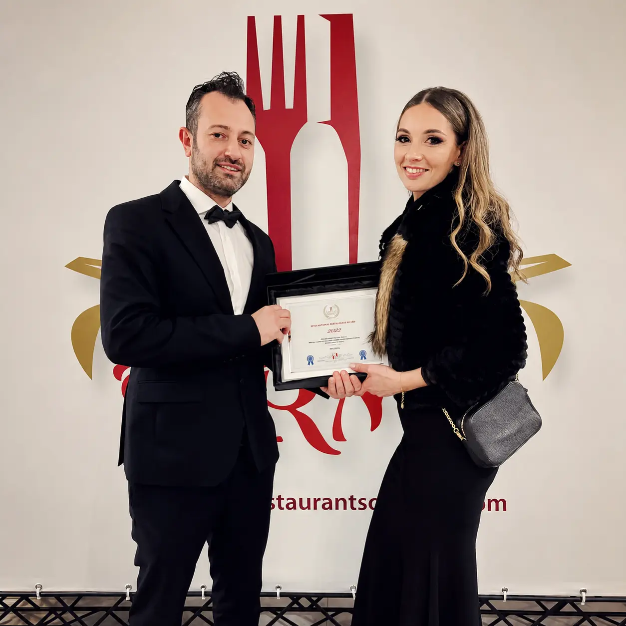 Malcolm and Sherrie receiving an international restaurant award